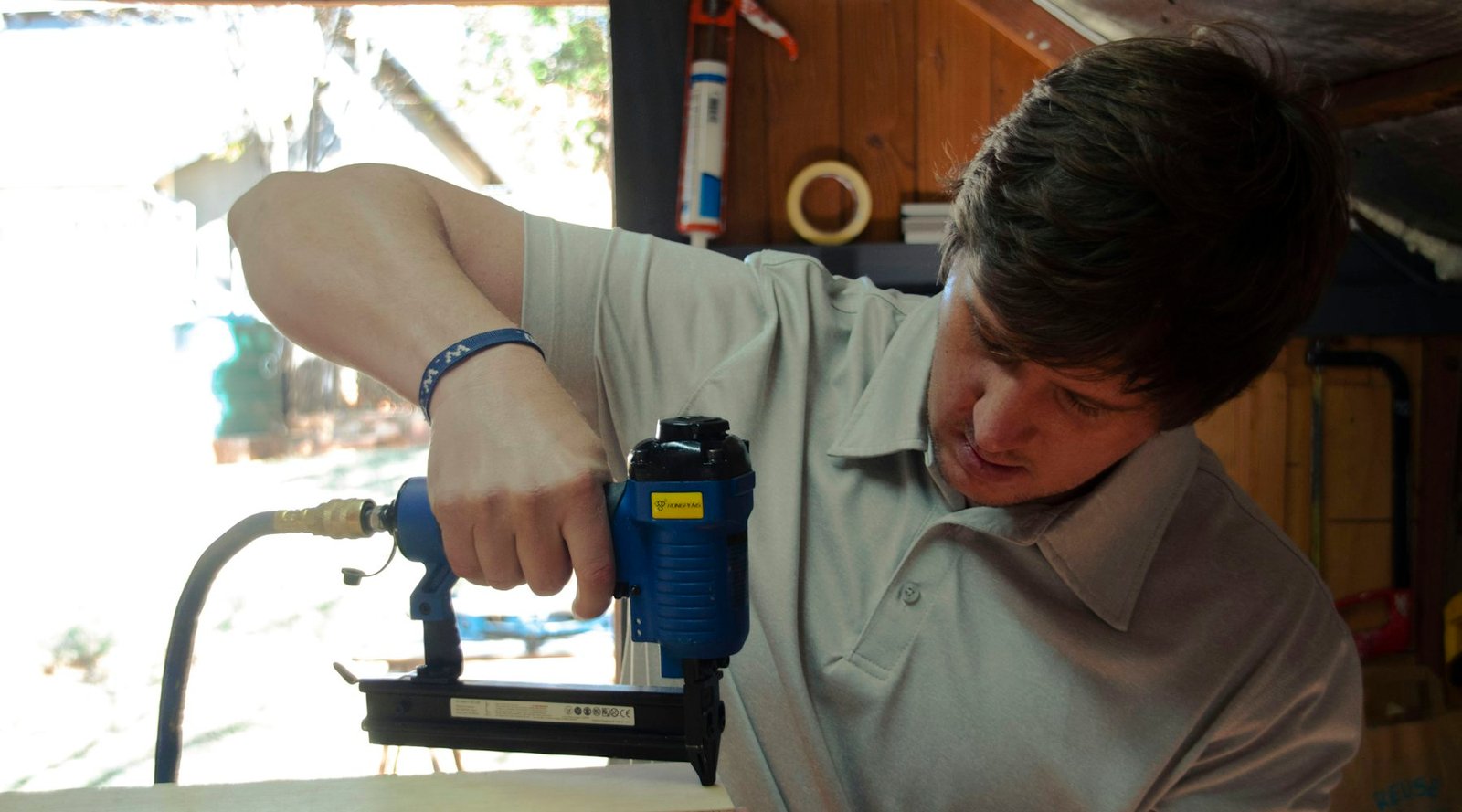 A craftsman drilling into a piece of wood