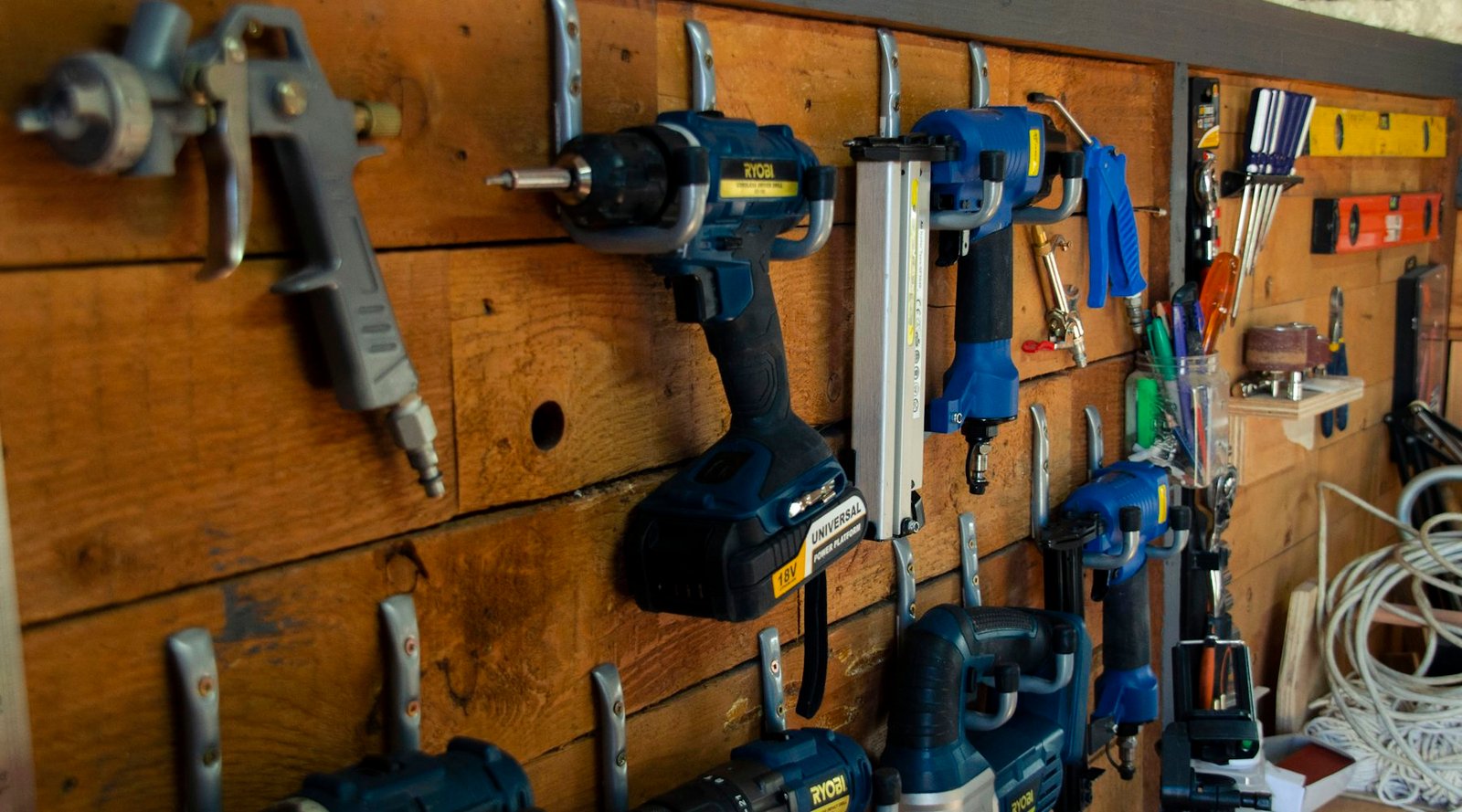 Hand tools hanging on a workshop wall