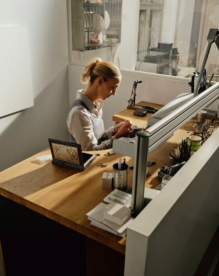 A craftswoman working at a bench