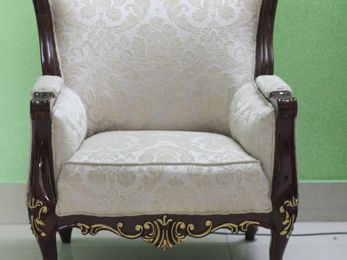 An armchair in a bright corner of a room